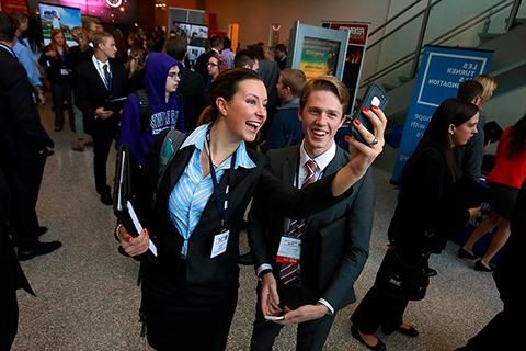 足彩平台 juniors Nate Hayworth and Karlee Nimmer pose for a selfie in the lobby of Hyland Hall at the AMA conference. 