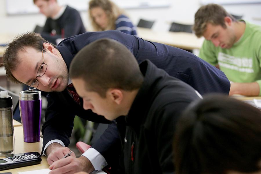 Professor Matthew Winden works with a student